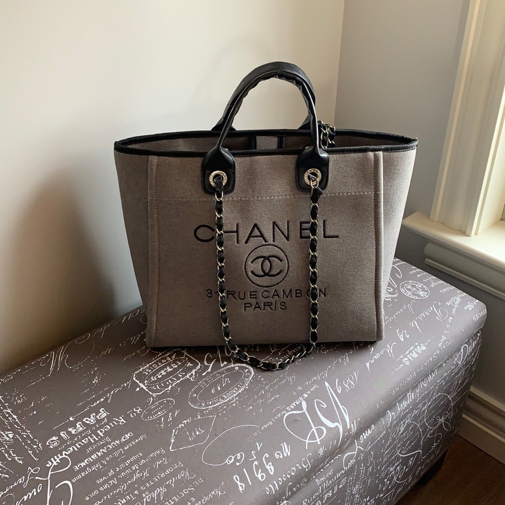 Grey, black, tote made of durable fabric and leatherette handles. EUC.